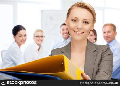 business concept - woman with folders in office