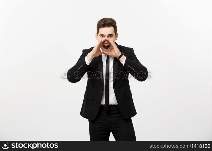 Business Concept: young handsome business man shouting and isolated on white. Business Concept: young handsome business man shouting and isolated on white.