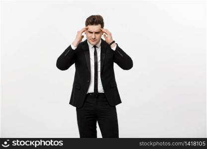 Business Concept: Young handsome businessman with pain in his temples. Photo of man suffering from stress or a headache grimacing in pain. Business Concept: Young handsome businessman with pain in his temples. Photo of man suffering from stress or a headache grimacing in pain.