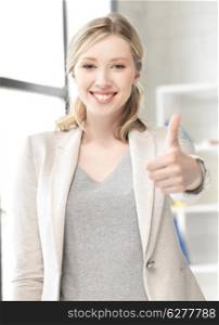 business concept - young woman with thumbs up