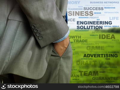 Business concepts. Bottom view of businessman and business writing at background