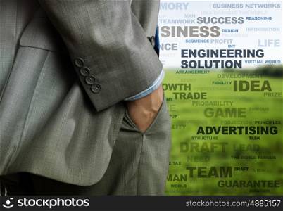 Business concepts. Bottom view of businessman and business writing at background
