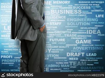 Business concepts. Bottom view of businessman and business writing at background