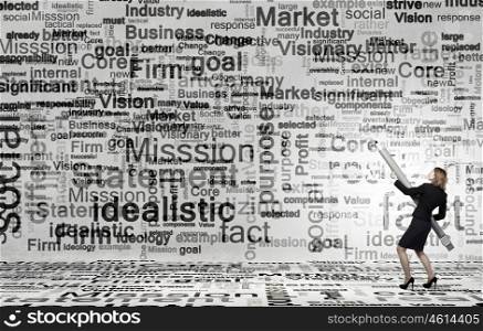 Business concepts. Young businesswoman writing marketing strategy concept with huge pencil