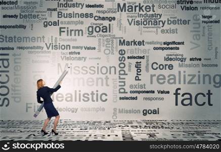 Business concepts. Young businesswoman writing marketing strategy concept with huge pencil