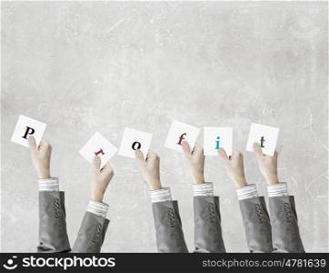 Business conceptual keywords. Group of business people holding in hands cards with letters