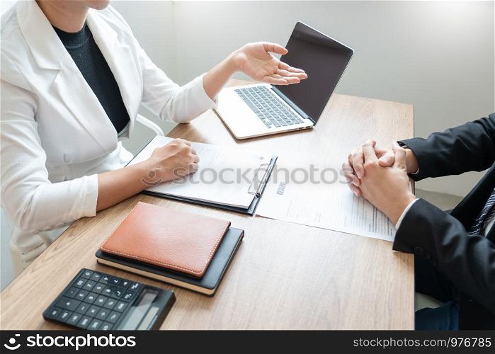 Business consulting candidate employee in suit looking skeptical reading a resume, hr speaking at job interview and recruitment concept