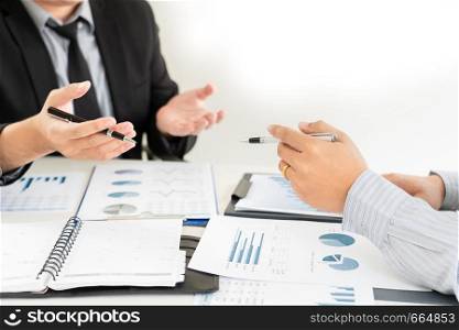 Business Corporate team brainstorming, Planning Strategy having a discussion Analysis investment researching with chart at office his desk documents and saving concept.