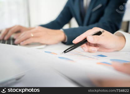 Business Corporate team brainstorming, Planning Strategy having a discussion Analysis investment researching with chart at office his desk documents and saving concept.