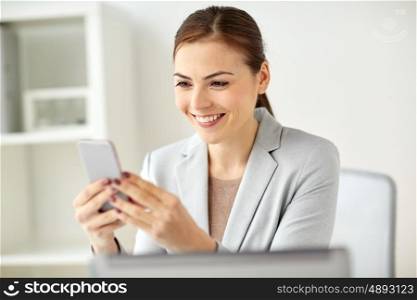 business, corporate, technology and people concept - businesswoman with smartphone at office