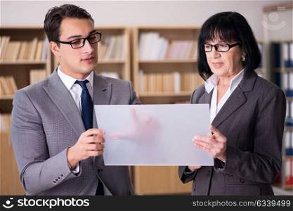 Business couple discussing business results on tablet