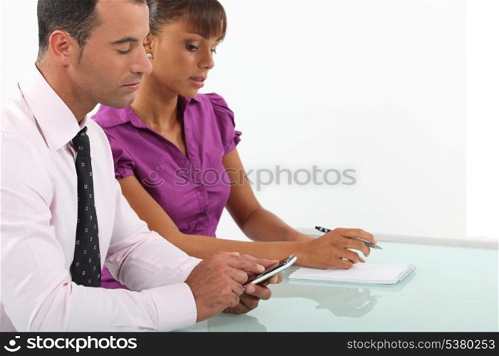 Business couple going over accounts