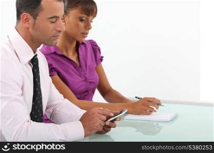 Business couple going over accounts