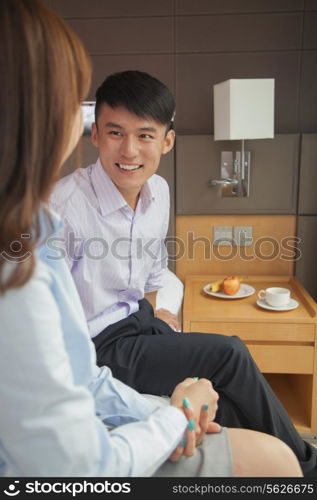 Business couple in hotel room