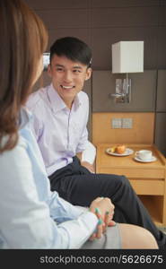 Business couple in hotel room