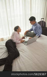 Business couple in hotel room