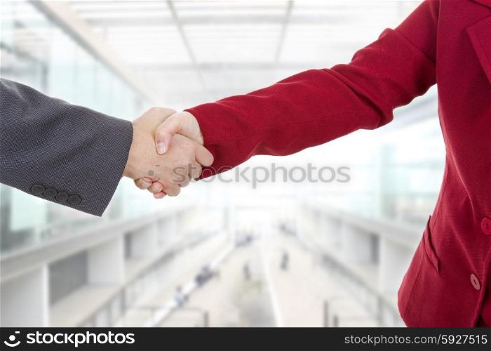 business couple shaking hands at the office