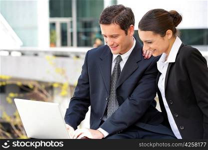 Business couple with a laptop computer
