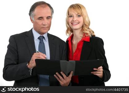 Business couple with a planner