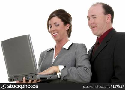 Business Couple With Laptop Computer. Man and Woman in Suits.