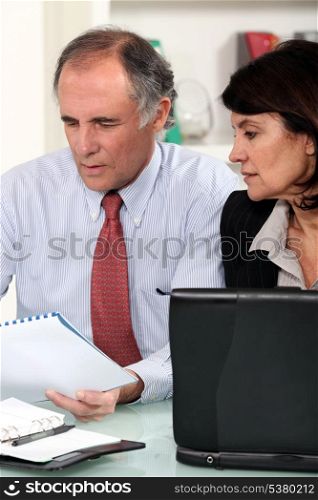 Business couple working at a desk