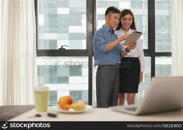 Business couple working together in hotel room