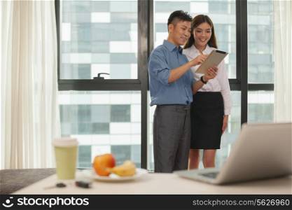 Business couple working together in hotel room