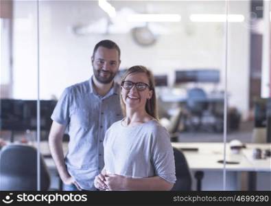 business couple working together on project at modern startup office