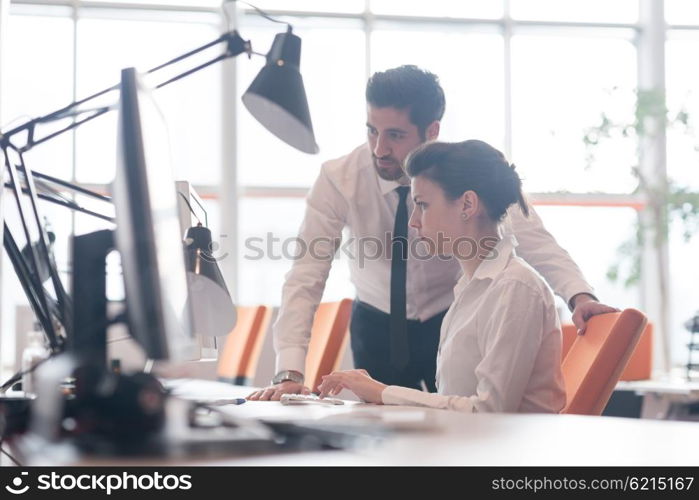 business couple working together on project at modern startup office