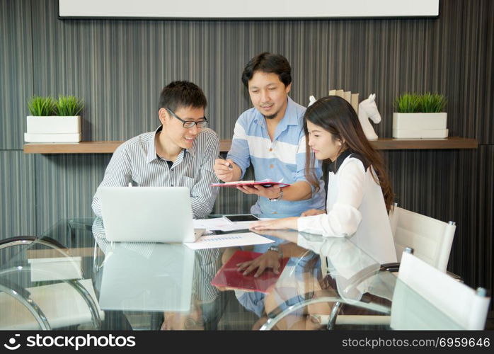 Business coworkers discussing in meeting room in office