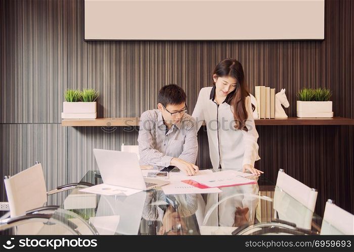 Business coworkers discussing in meeting room in office