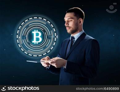 business, cryptocurrency and future technology concept - businessman with transparent tablet pc computer and virtual bitcoin symbol hologram over space background. businessman with tablet pc and bitcoin hologram. businessman with tablet pc and bitcoin hologram