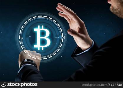 business, cryptocurrency and future technology concept - close up of businessman hands with smart watch and bitcoin hologram over space background. businessman with smart watch and bitcoin hologram. businessman with smart watch and bitcoin hologram