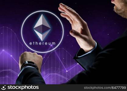 business, cryptocurrency and future technology concept - close up of businessman hands with smart watch and ethereum hologram over charts and ultra violet space background. hands with smart watch and ethereum hologram. hands with smart watch and ethereum hologram
