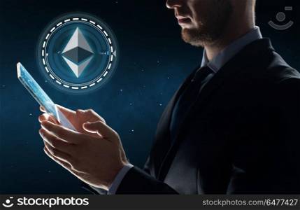 business, cryptocurrency and future technology concept - close up of businessman with transparent tablet pc computer and virtual ethereum symbol hologram over binary code background. businessman with tablet pc and ethereum hologram. businessman with tablet pc and ethereum hologram