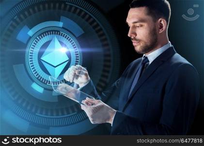 business, cryptocurrency and future technology concept - close up of businessman with transparent tablet pc computer and virtual ethereum symbol hologram over dark background. businessman with tablet pc and ethereum hologram. businessman with tablet pc and ethereum hologram