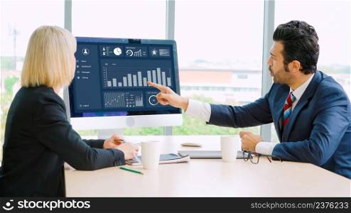 Business data dashboard analysis by ingenious computer software . Investment application display business sales and profit on the computer screen and advise marketing planning decision .. Business data dashboard analysis by ingenious computer software