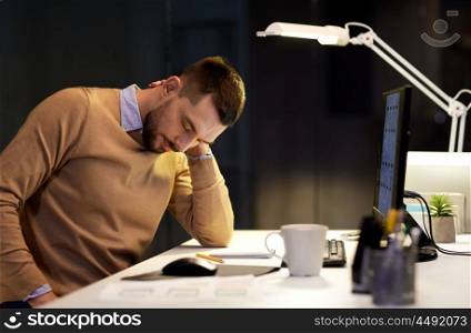 business, deadline and health concept - tired man having neckache working at night office. tired man having neck ache working at night office. tired man having neck ache working at night office