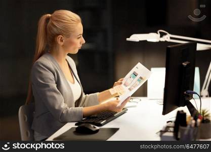 business, deadline and technology concept - businesswoman or web designer with user interface design mockup and computer working at night office. web designer user interface mockup at night office. web designer user interface mockup at night office