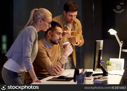 business, deadline and technology concept - coworkers with computer and takeout food and coffee working late at night office. business team with computer working late at office