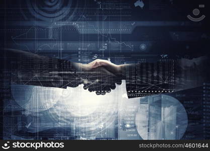 Business deal. Close up of business handshake on digital background