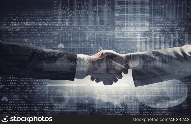 Business deal. Close up of business handshake on digital background