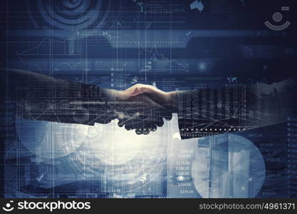 Business deal. Close up of business handshake on digital background