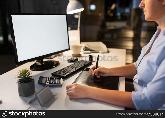 business, design and technology concept - creative woman or graphic designer with computer and pen tablet working at night office. designer with computer and pen tablet at office