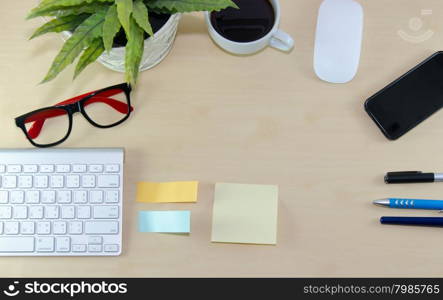 Business desk with coffee, mouse and pen on wooden table