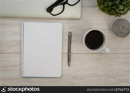 Business desktop objects on a grey wooden background