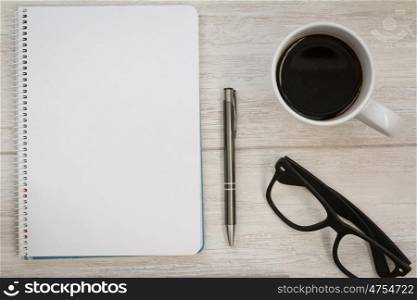 Business desktop objects on a grey wooden background