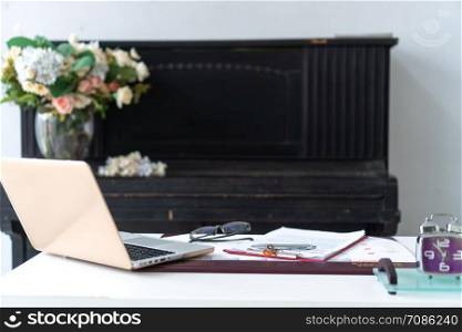 Business desktop with laptop, glasses, business schedule
