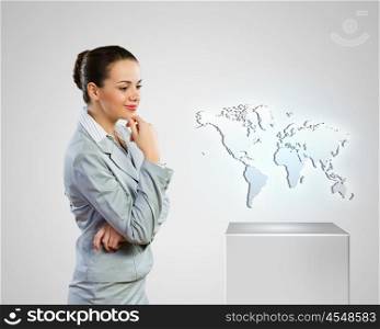 Business development. Image of businesswoman looking at world map