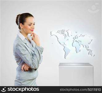 Business development. Image of businesswoman looking at world map